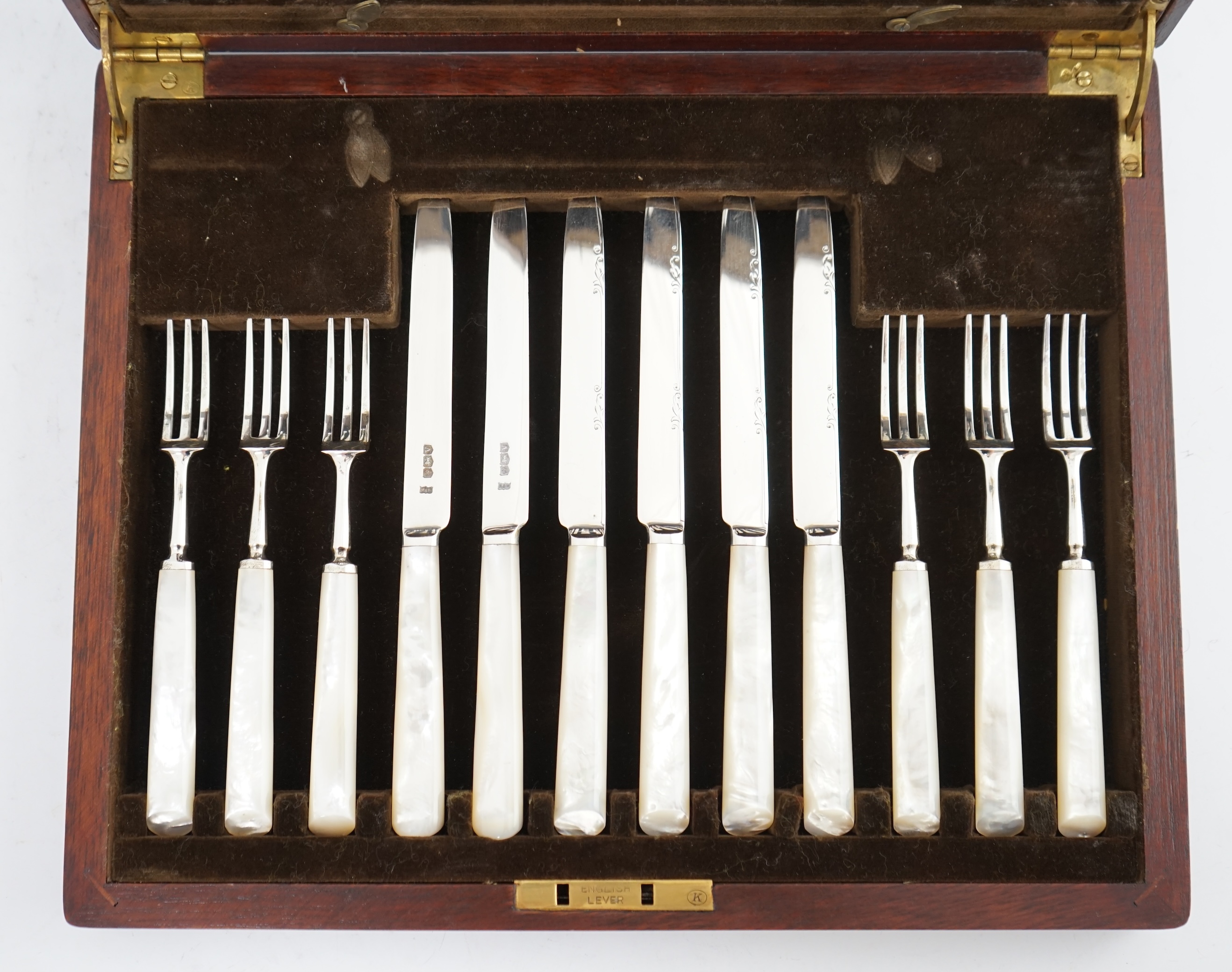 A cased set of twelve pairs of George VI mother of pearl handled silver dessert eaters, by Mappin & Webb